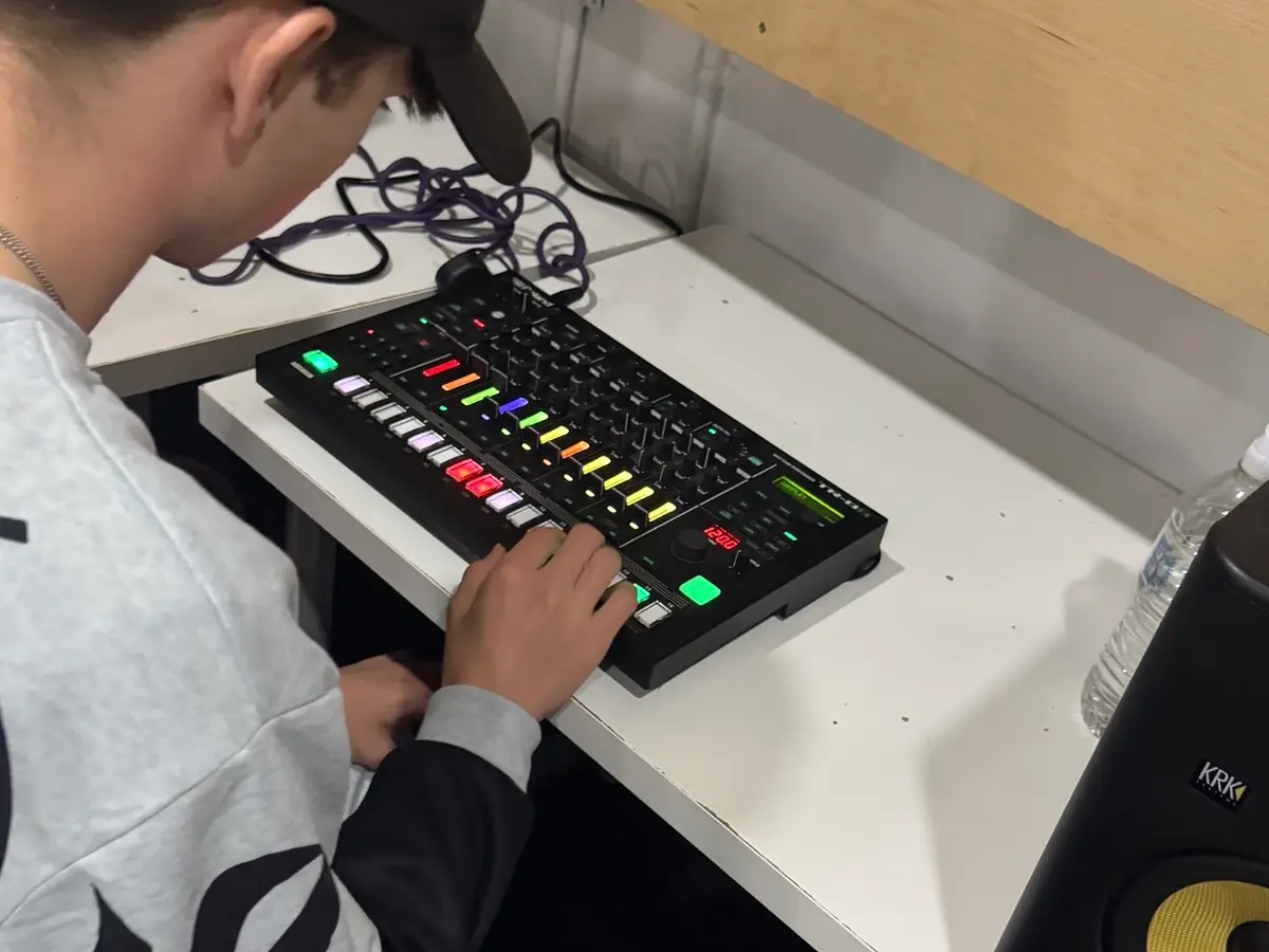 Participant programming a beat on a drum machine