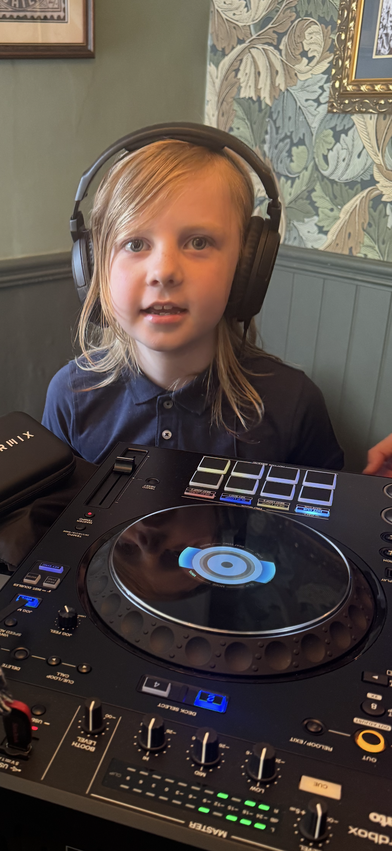 Young person learning to DJ